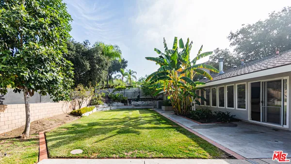 an aerial view of a house with a garden