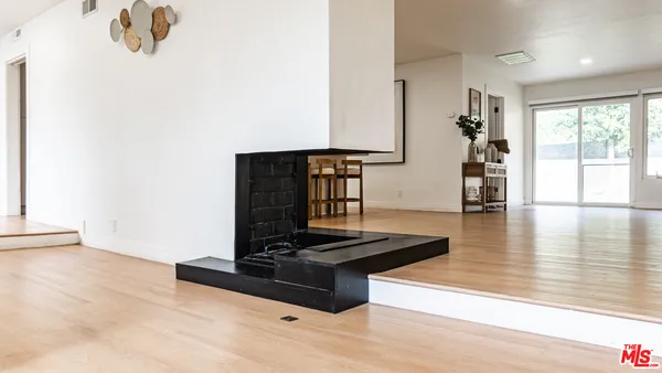 a living room with a couch and a large window