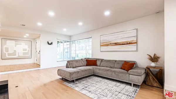 a bedroom with a bed and a flat screen television
