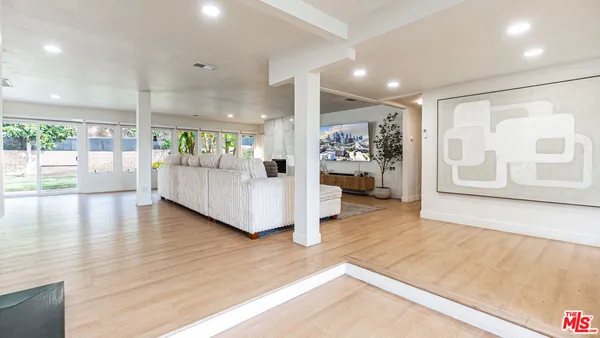 a bedroom with furniture and a fireplace