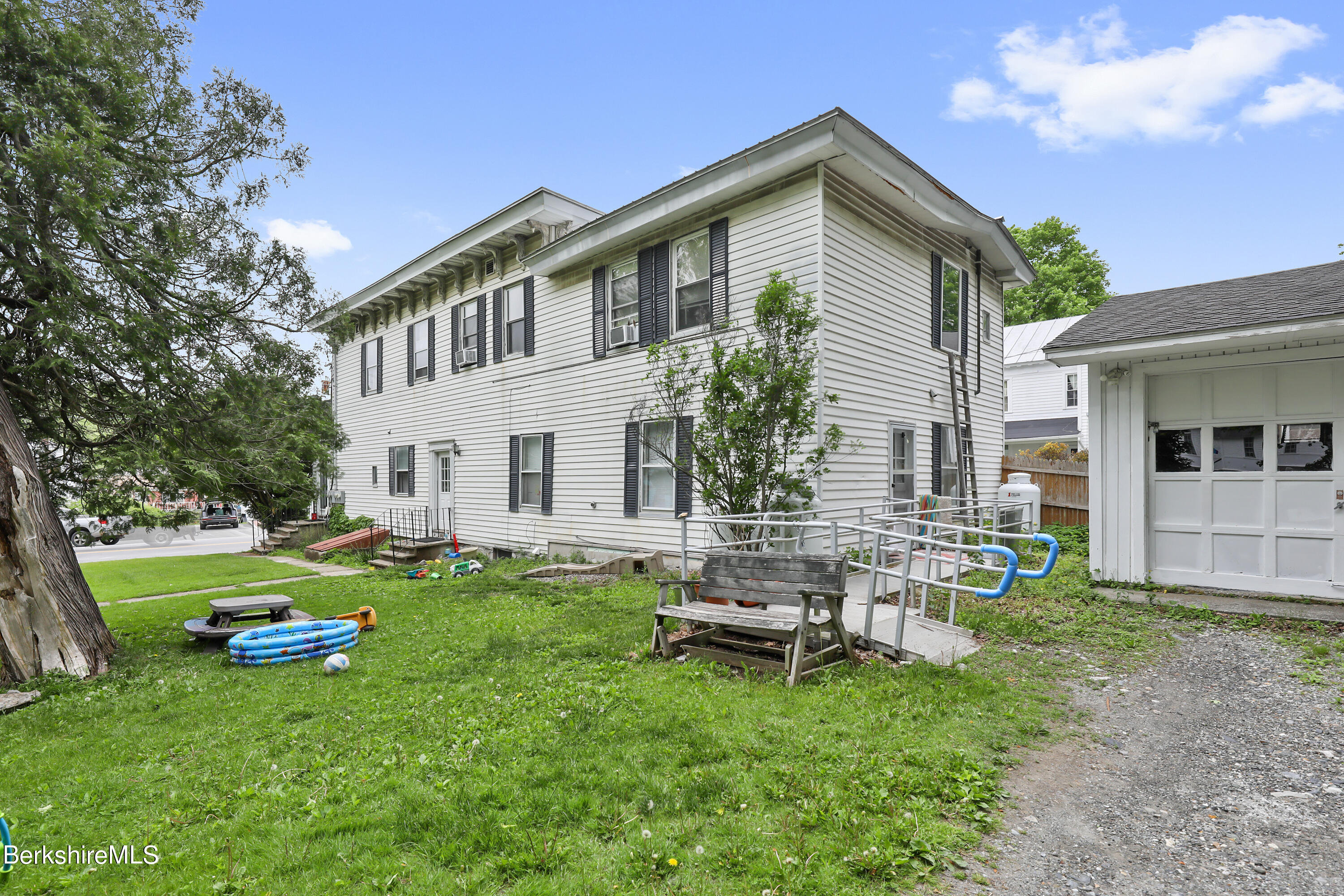 35 Main Street West Stockbridge, MA 01266 - Photo 3 of 6 a view of a house with backyard sitting area and garden