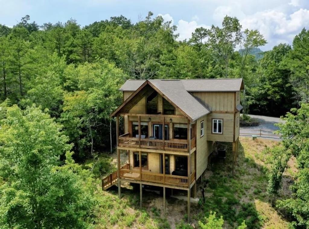 80 Tom Tom Trail Blue Ridge, GA 30513 - Photo 1 of 67 an aerial view of a house with yard and trees in the background