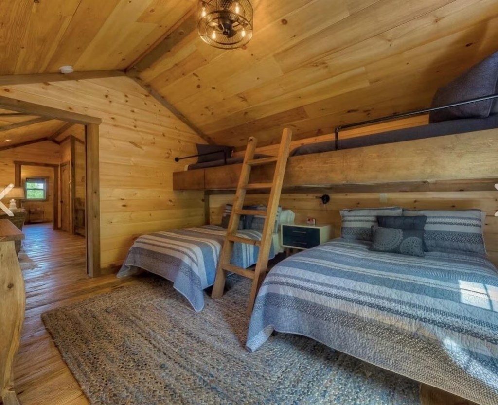 80 Tom Tom Trail Blue Ridge, GA 30513 - Photo 20 of 67 a bedroom with a bed and wooden floor