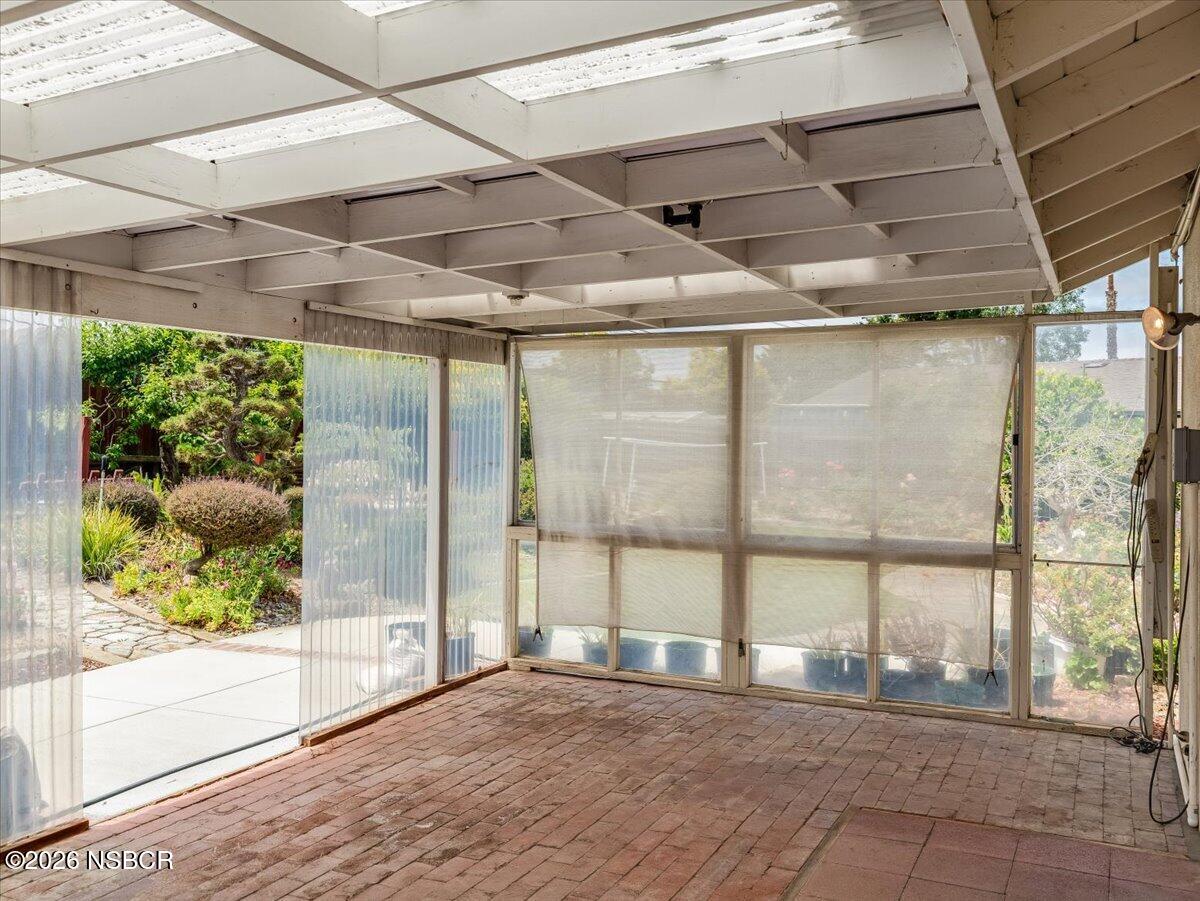 360 Tallyho Road Santa Maria, CA 93455 - Photo 45 of 72 a view of an empty room with a sliding door