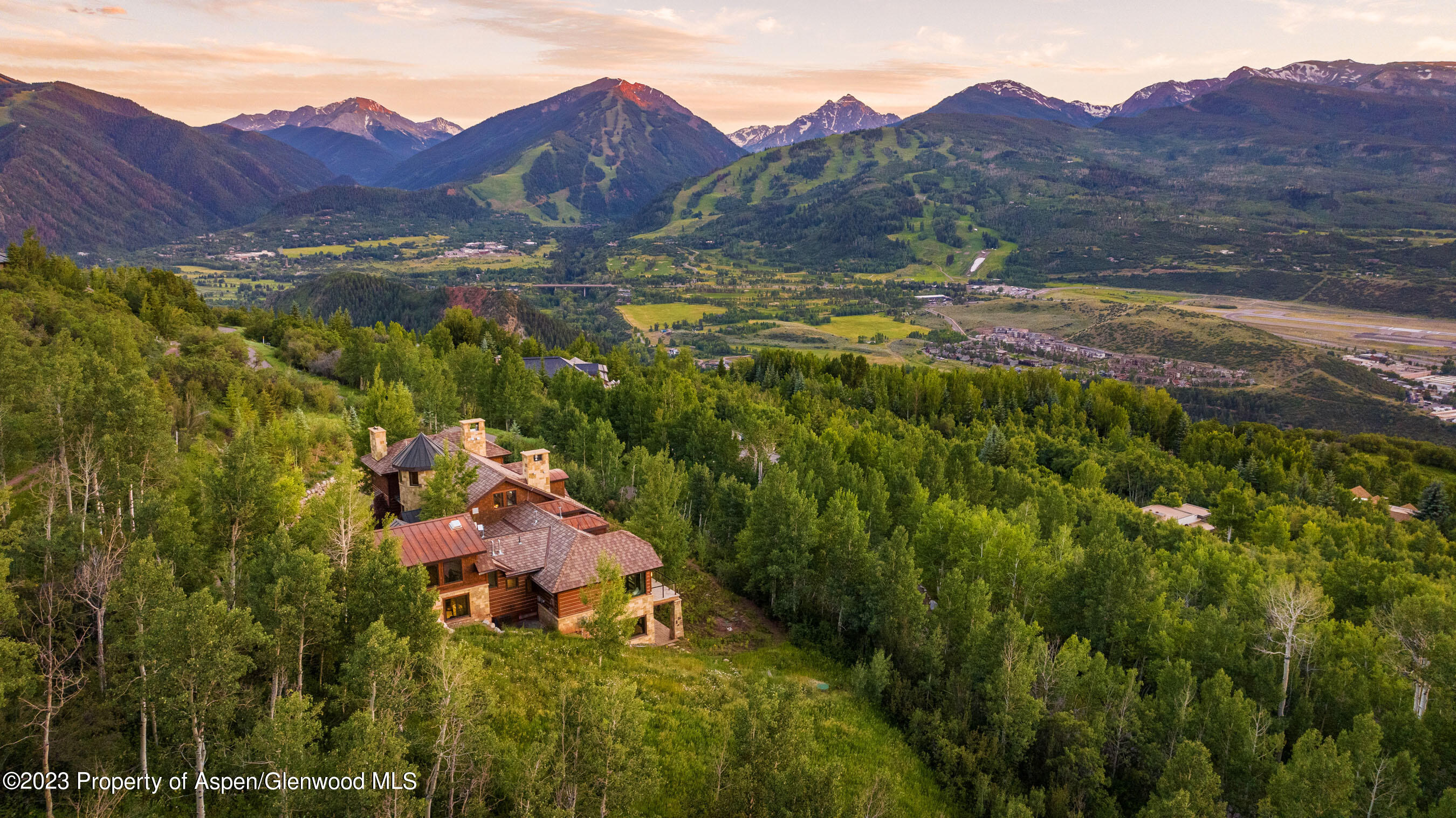 70 Larson Road Aspen, CO 81612 - Photo 1 of 55 a view of a town with mountains in the background