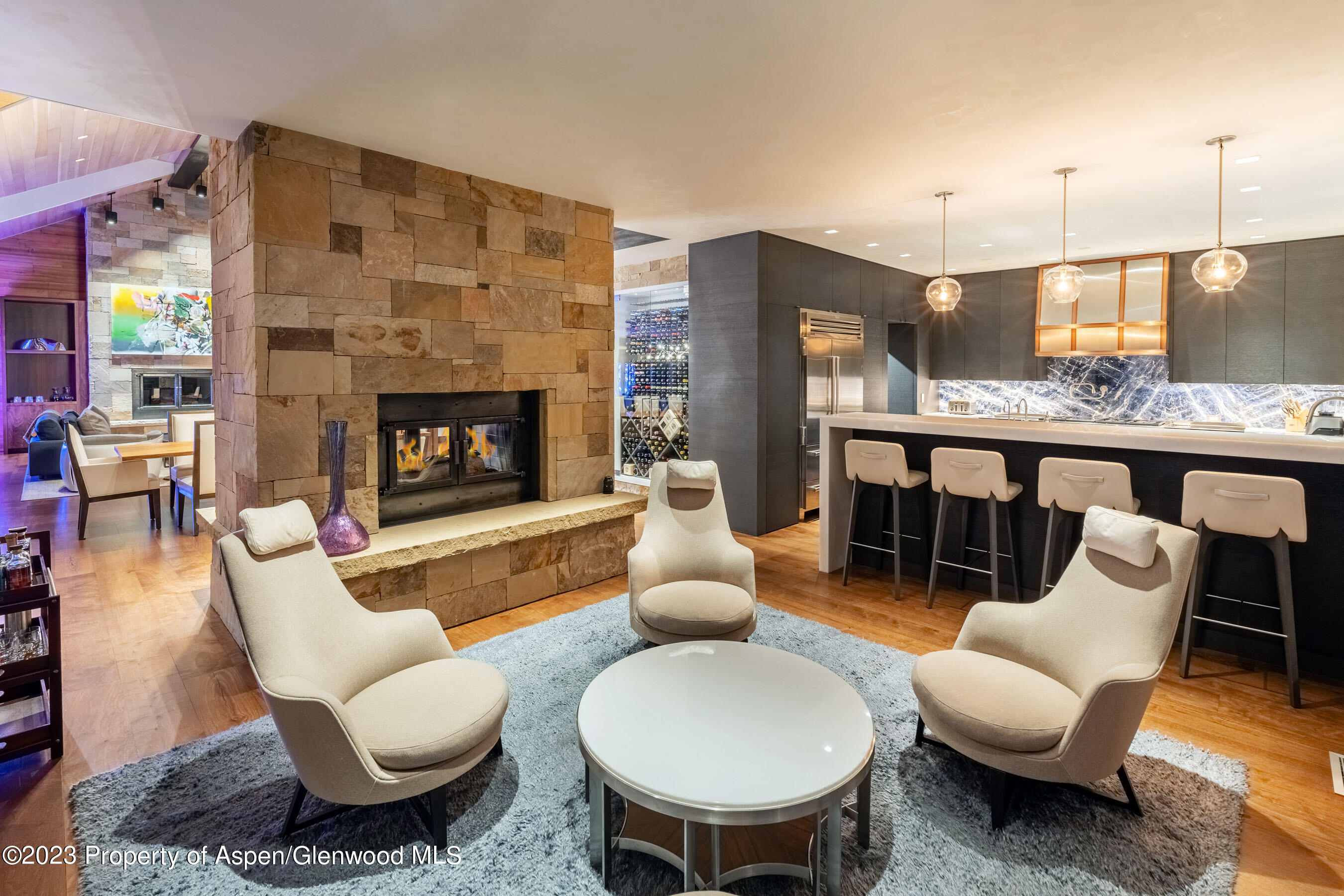 70 Larson Road Aspen, CO 81612 - Photo 19 of 55 a living room with furniture a table and kitchen view