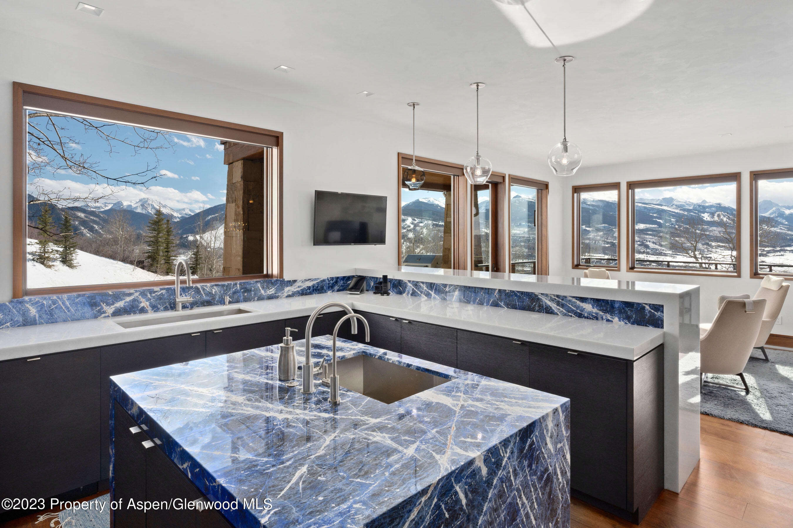 70 Larson Road Aspen, CO 81612 - Photo 26 of 55 a kitchen with a stove a sink and a granite counter top