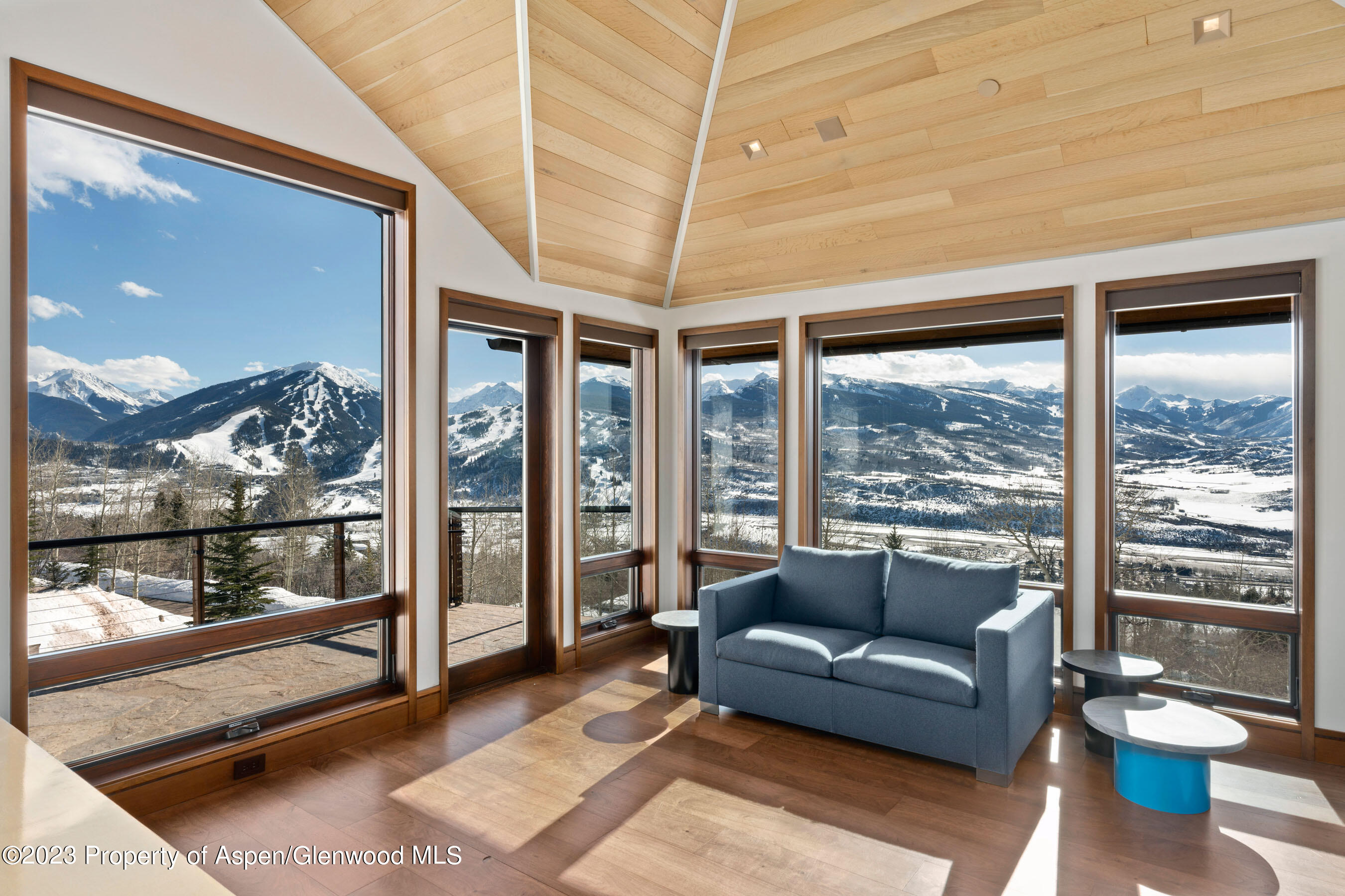 70 Larson Road Aspen, CO 81612 - Photo 29 of 55 a living room with furniture and a floor to ceiling window