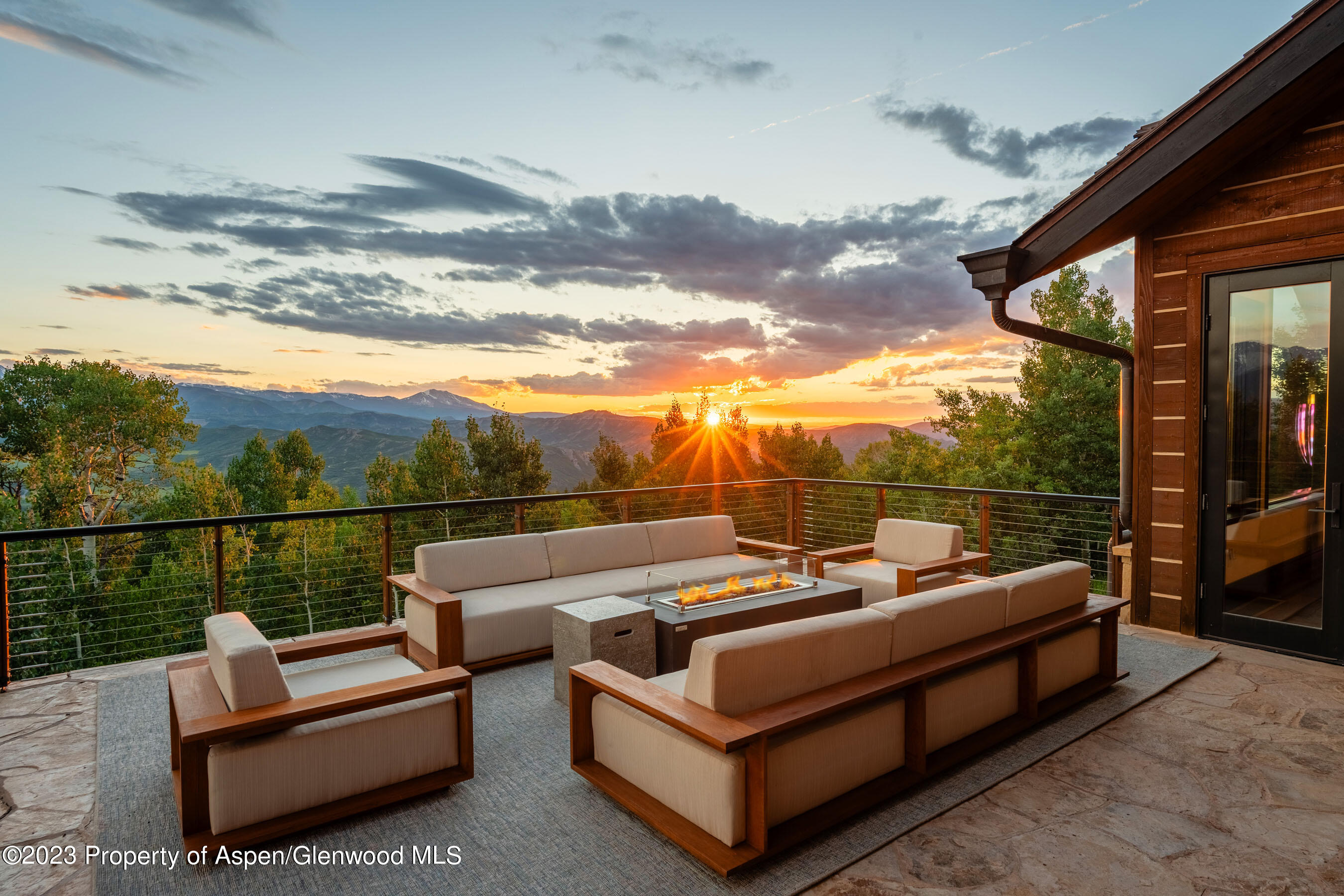 70 Larson Road Aspen, CO 81612 - Photo 3 of 55 a view of a roof deck with couches and sky view