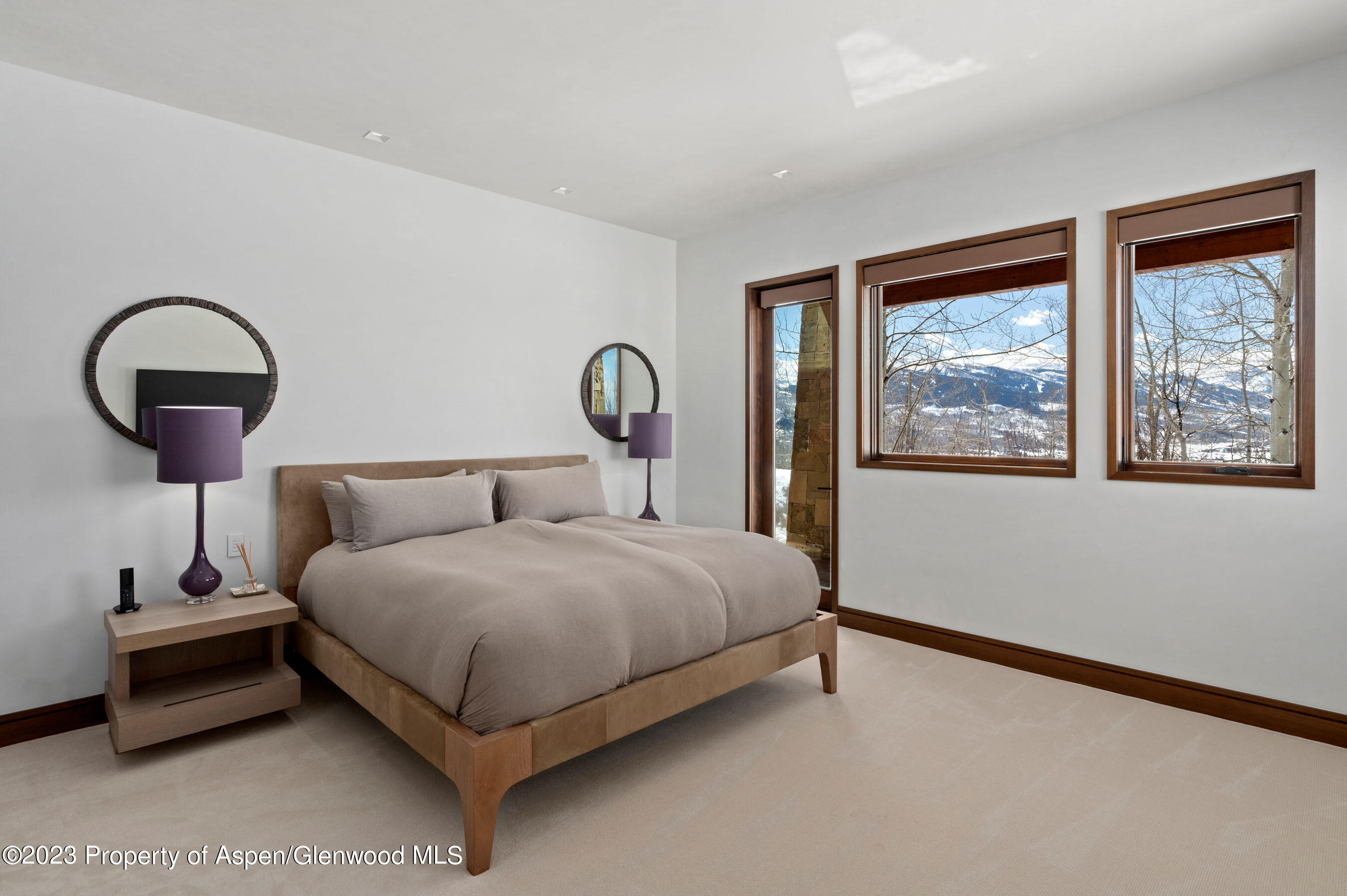 70 Larson Road Aspen, CO 81612 - Photo 30 of 55 a bedroom with a bed and a large window