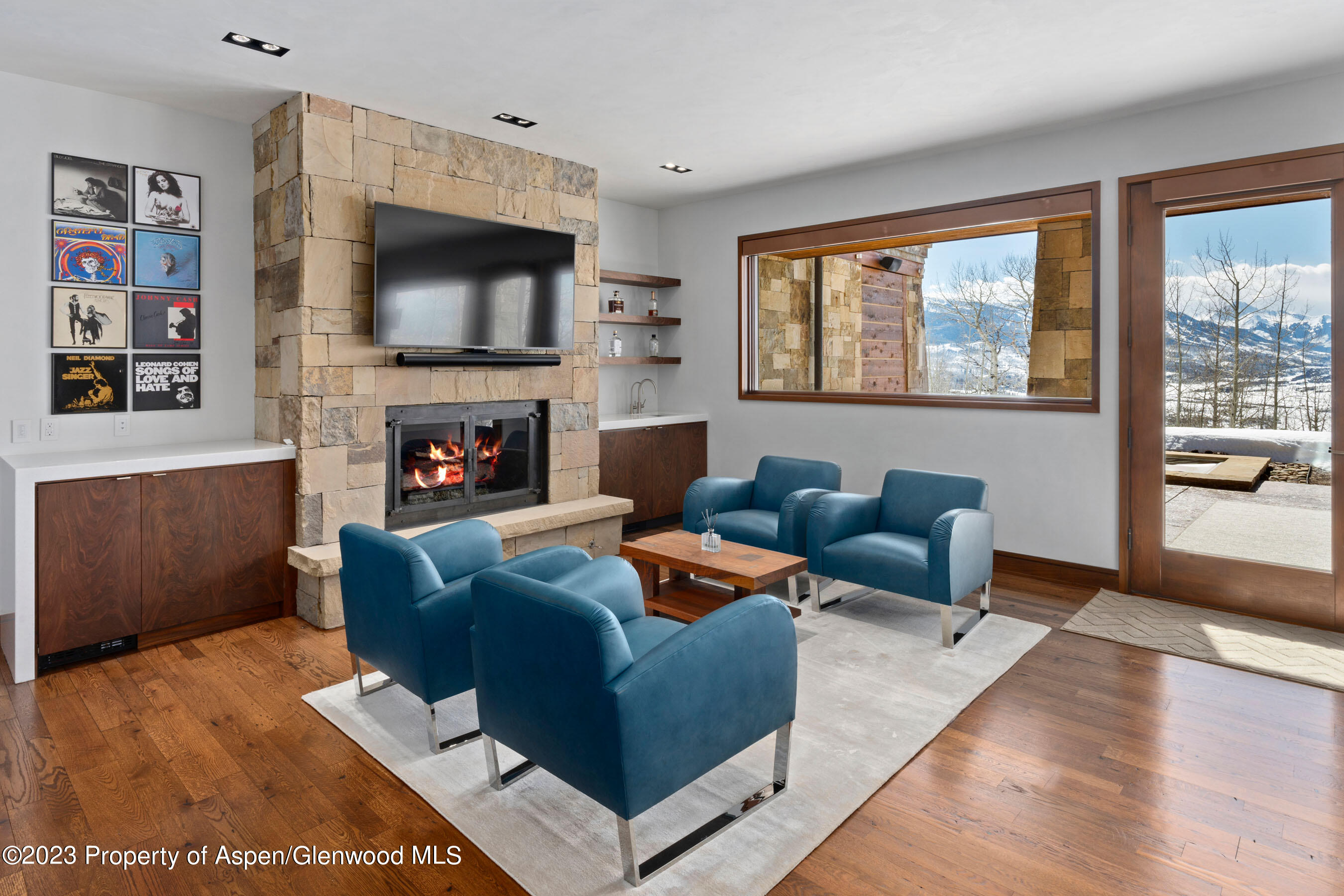 70 Larson Road Aspen, CO 81612 - Photo 35 of 55 a living room with fireplace furniture and a flat screen tv