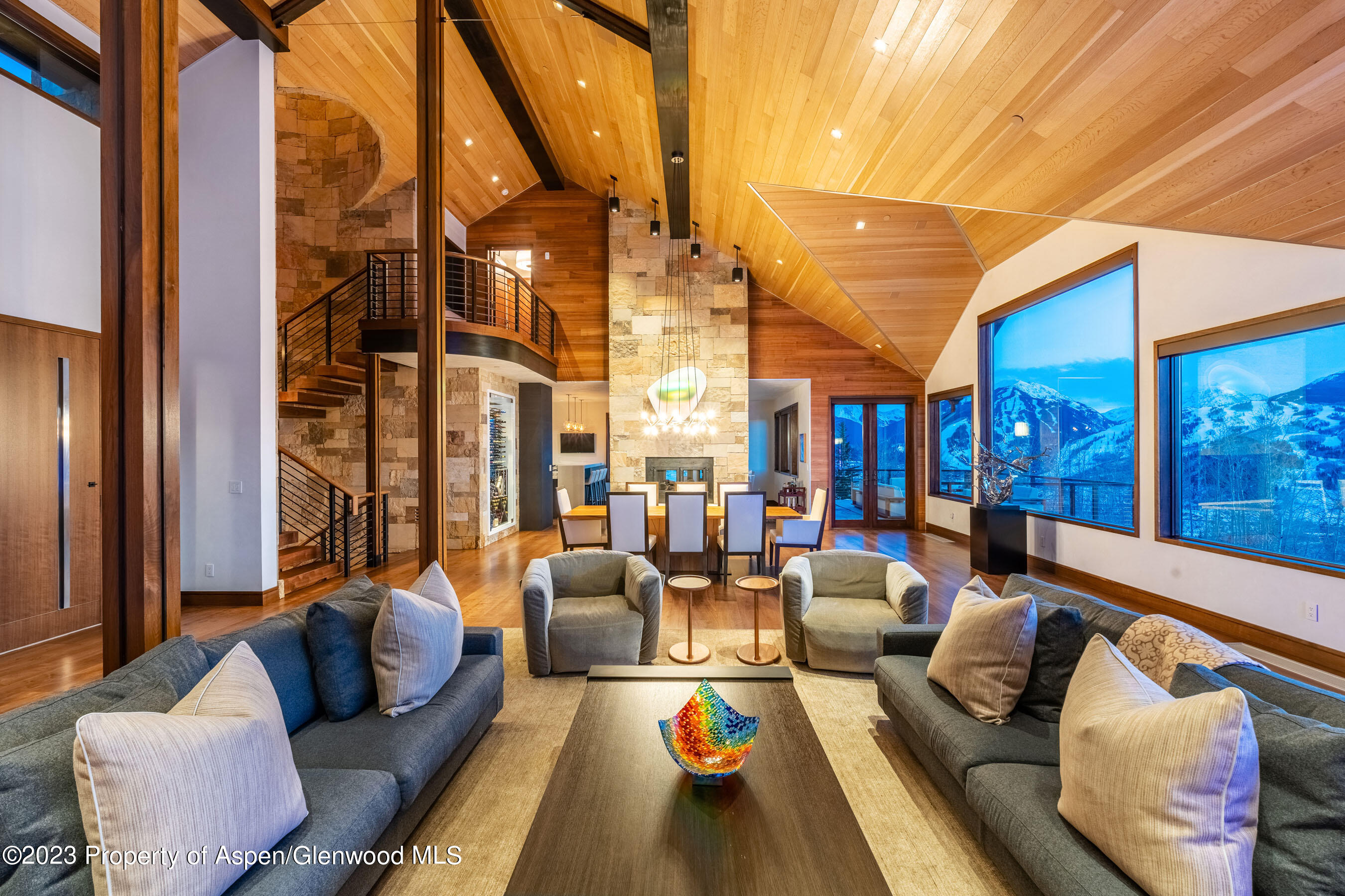 70 Larson Road Aspen, CO 81612 - Photo 7 of 55 a living room with furniture fireplace and a large window