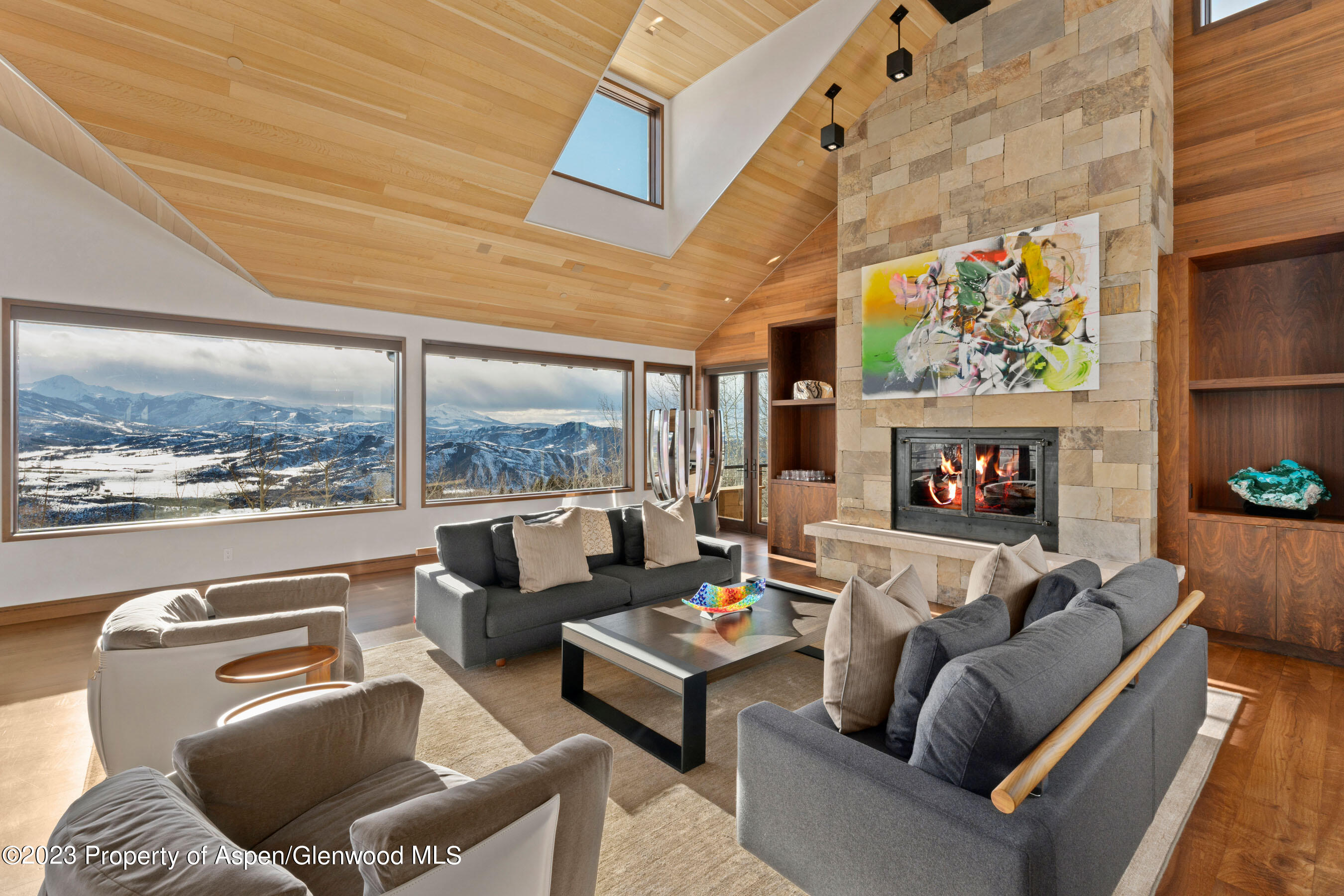 70 Larson Road Aspen, CO 81612 - Photo 9 of 55 a living room with furniture fireplace and a large window