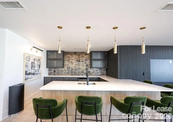 a kitchen with a table and chairs in it