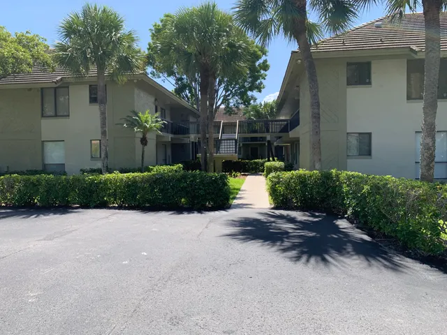 a view of an empty room with a fireplace