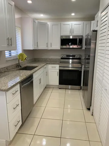 a view of a living room and chandelier