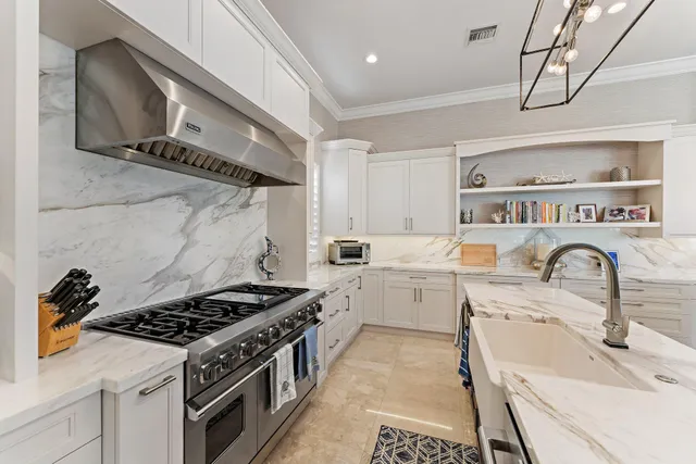 a kitchen with a sink cabinets and appliances
