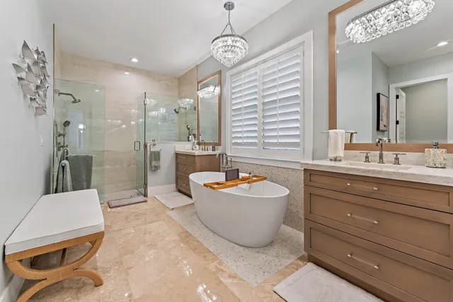 a bathroom with a double vanity sink mirror and shower