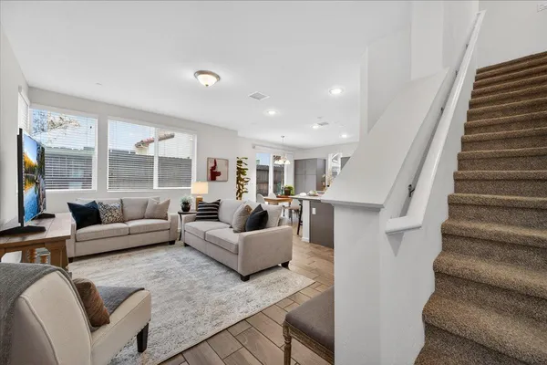 a living room with furniture and a large window