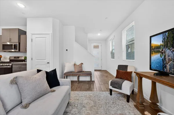 a living room with furniture and a flat screen tv