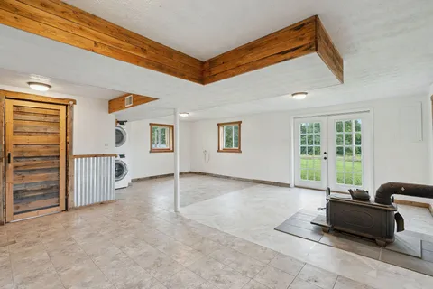 a living room with furniture and windows