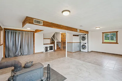 a view of a livingroom with furniture and garage