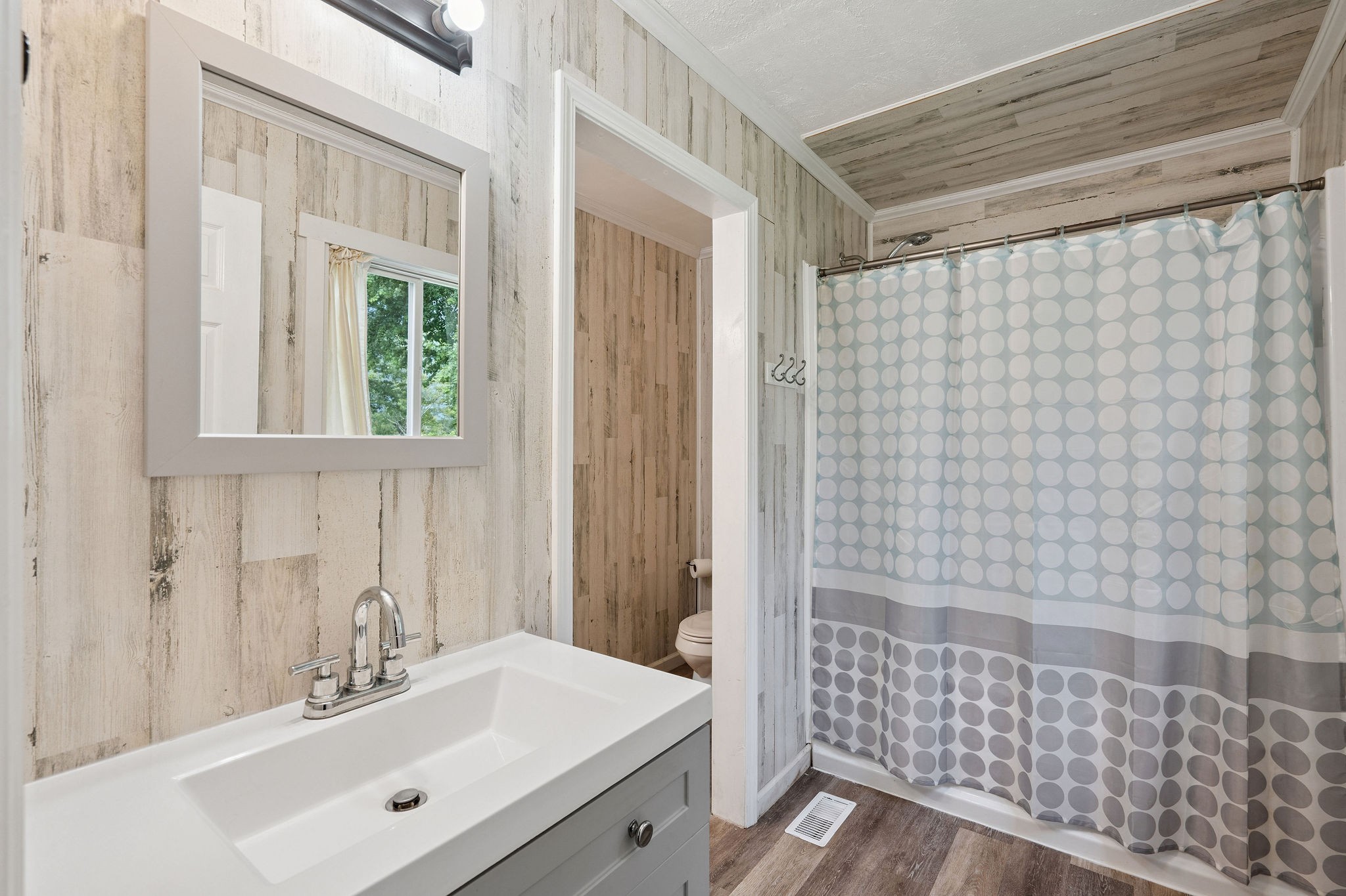 3037 Tunnel Road Westmoreland, TN 37186 - Photo 29 of 53 a bathroom with a sink a toilet and shower