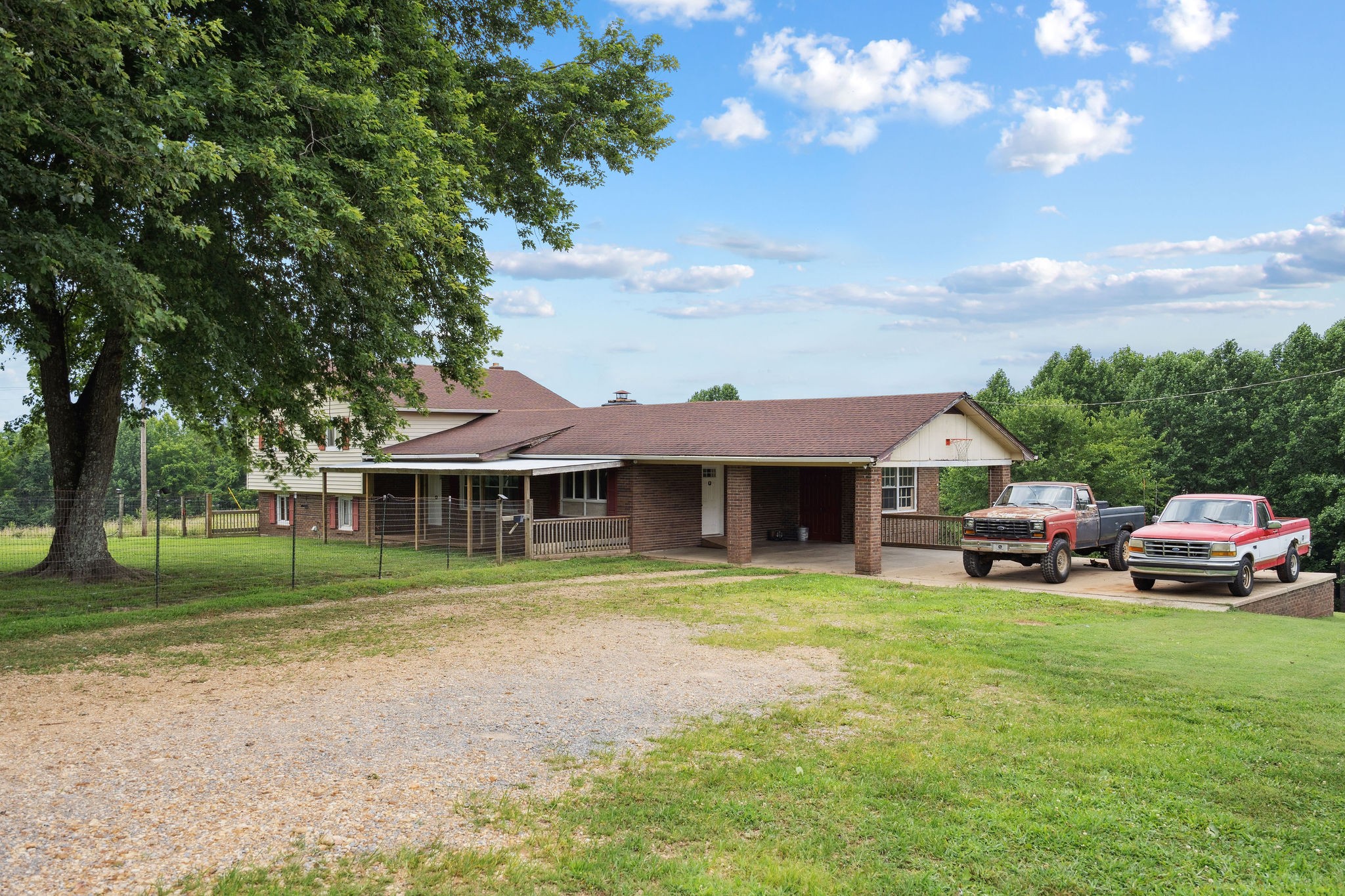 3037 Tunnel Road Westmoreland, TN 37186 - Photo 44 of 53 a front view of a house with a garden and trees