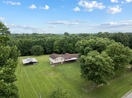 an aerial view of residential house with outdoor space