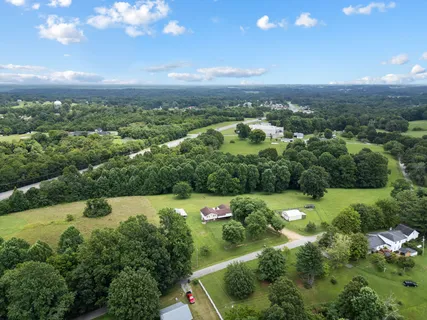a swimming pool with some trees in the background