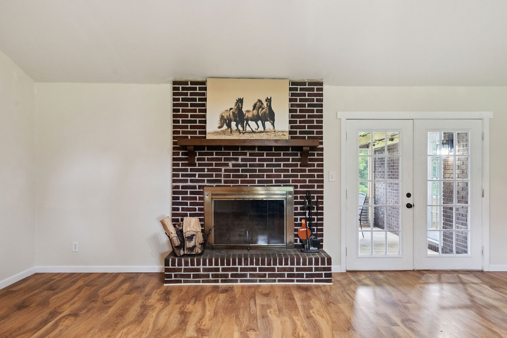 3037 Tunnel Road Westmoreland, TN 37186 - Photo 7 of 53 a view of a livingroom with wooden floor and a fireplace