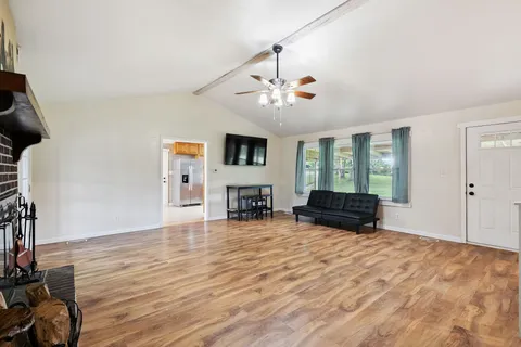 a view of livingroom with hardwood floor and a ceiling fan