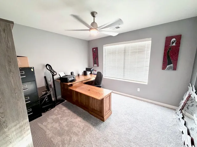 a bed room with a bed and a window