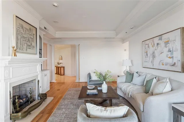 a living room with furniture and a fireplace