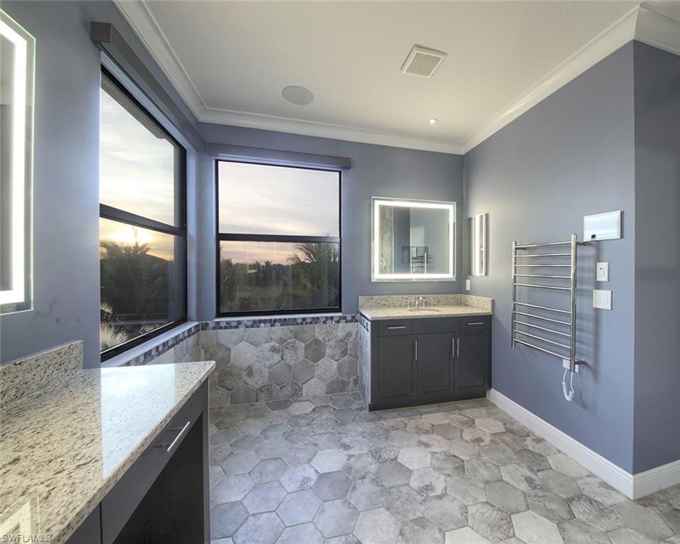 13693 Mandarin Circle Naples, FL 34109 - Photo 17 of 29 a large bathroom with a granite countertop tub shower and sink