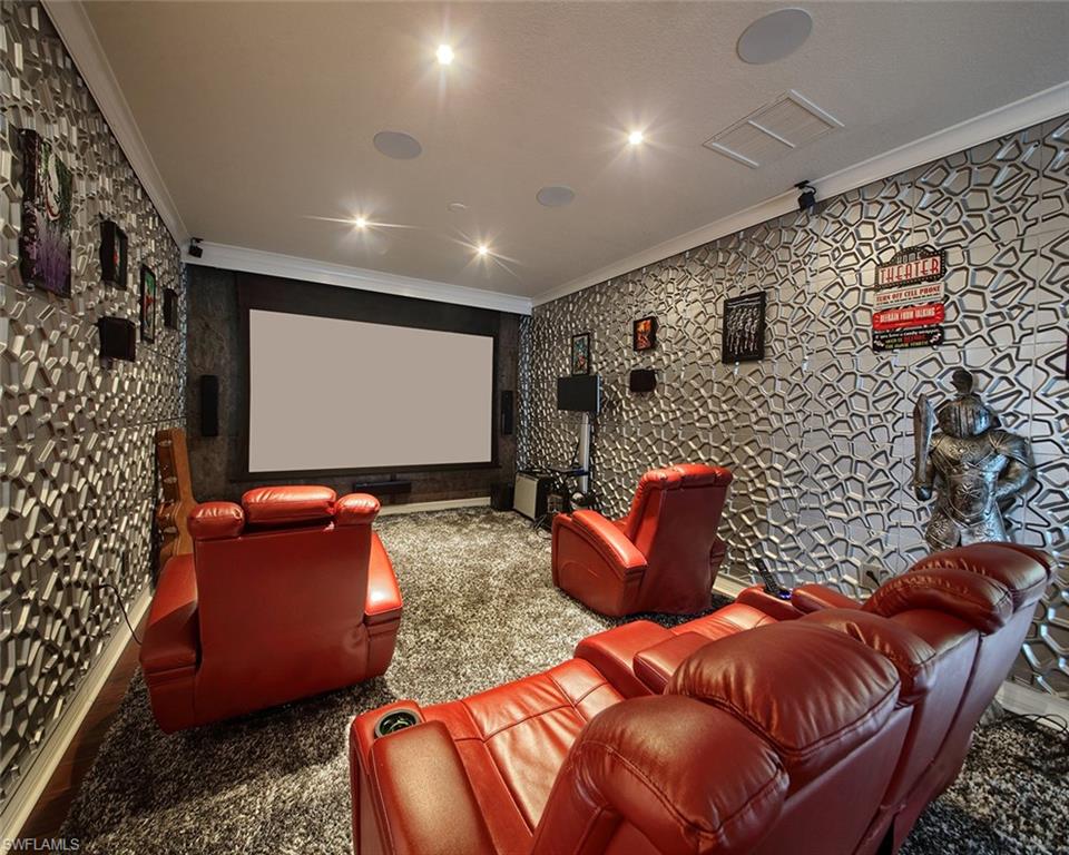 13693 Mandarin Circle Naples, FL 34109 - Photo 18 of 29 a projector room with a couch and a projector