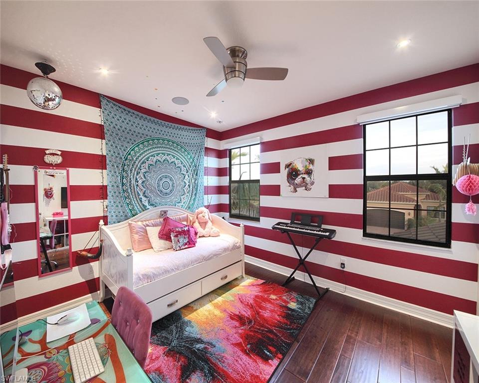 13693 Mandarin Circle Naples, FL 34109 - Photo 20 of 29 a living room with furniture and a rug