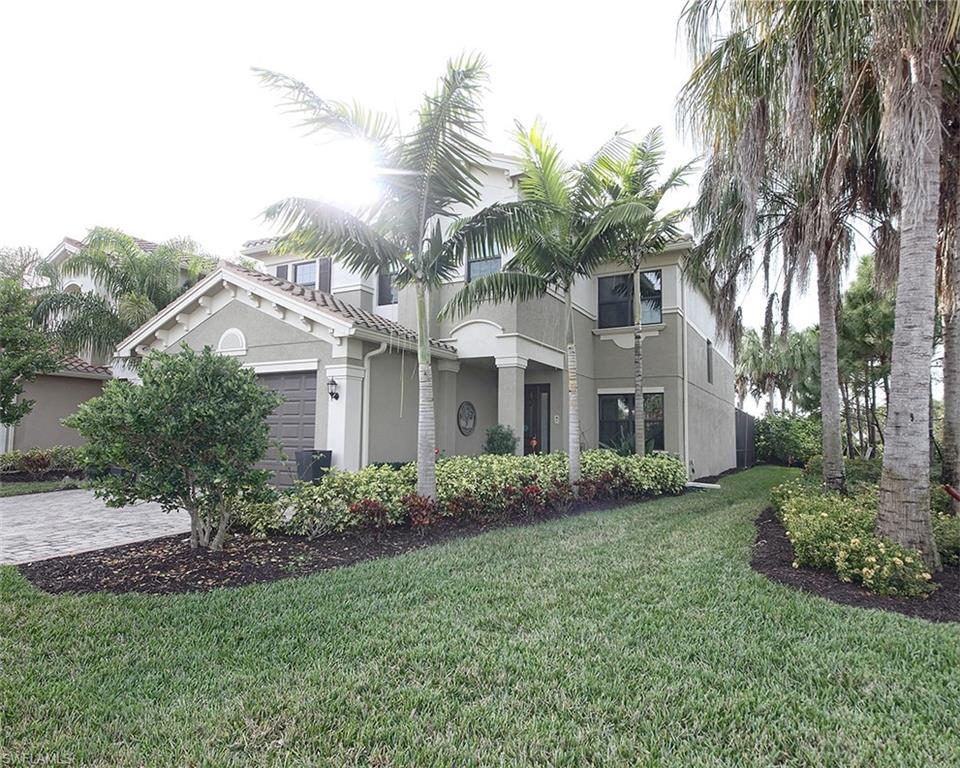 13693 Mandarin Circle Naples, FL 34109 - Photo 2 of 29 a view of a house with a yard and potted plants