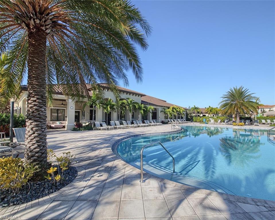 13693 Mandarin Circle Naples, FL 34109 - Photo 27 of 29 a view of a swimming pool with a patio