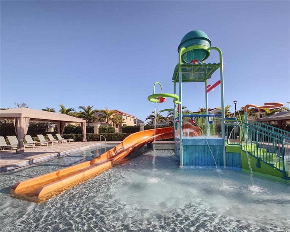 13693 Mandarin Circle Naples, FL 34109 - Photo 28 of 29 a view of a swimming pool with a lounge chair