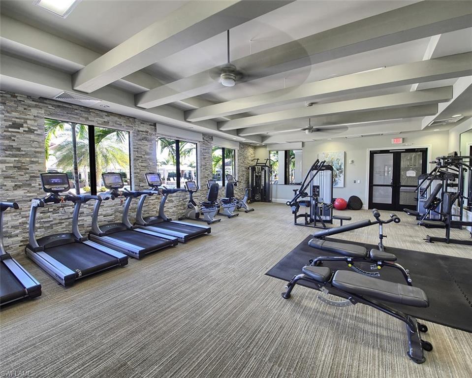 13693 Mandarin Circle Naples, FL 34109 - Photo 29 of 29 a view of a room with gym equipment