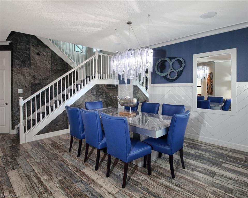 13693 Mandarin Circle Naples, FL 34109 - Photo 5 of 29 a view of a dining room with furniture