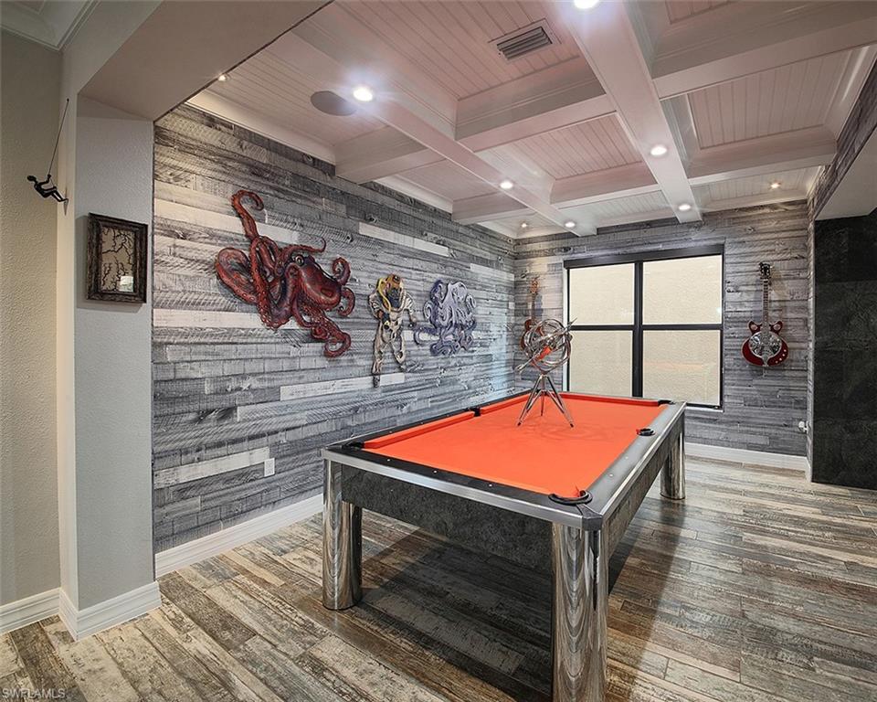 13693 Mandarin Circle Naples, FL 34109 - Photo 6 of 29 a room with table and chairs