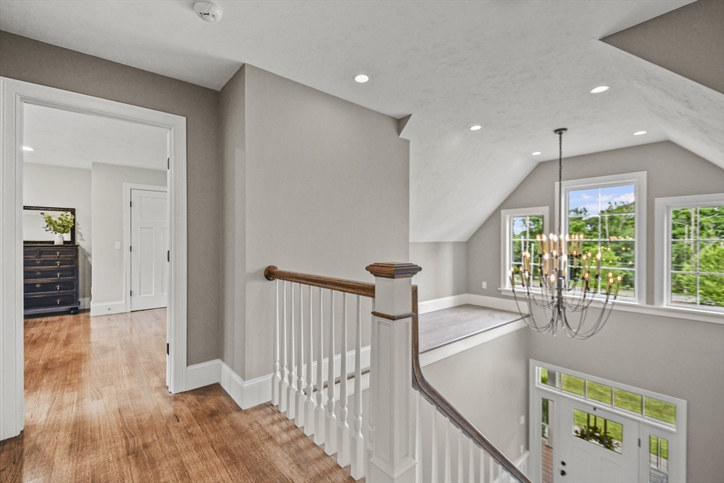 382 West Sutton Road Sutton, MA 01590 - Photo 23 of 42 a view of a hallway with wooden floor and staircase