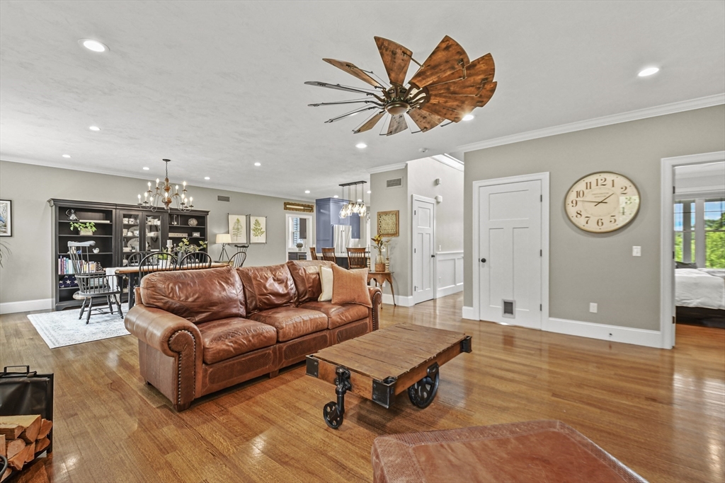 382 West Sutton Road Sutton, MA 01590 - Photo 5 of 42 a living room with furniture a clock on wall and a window