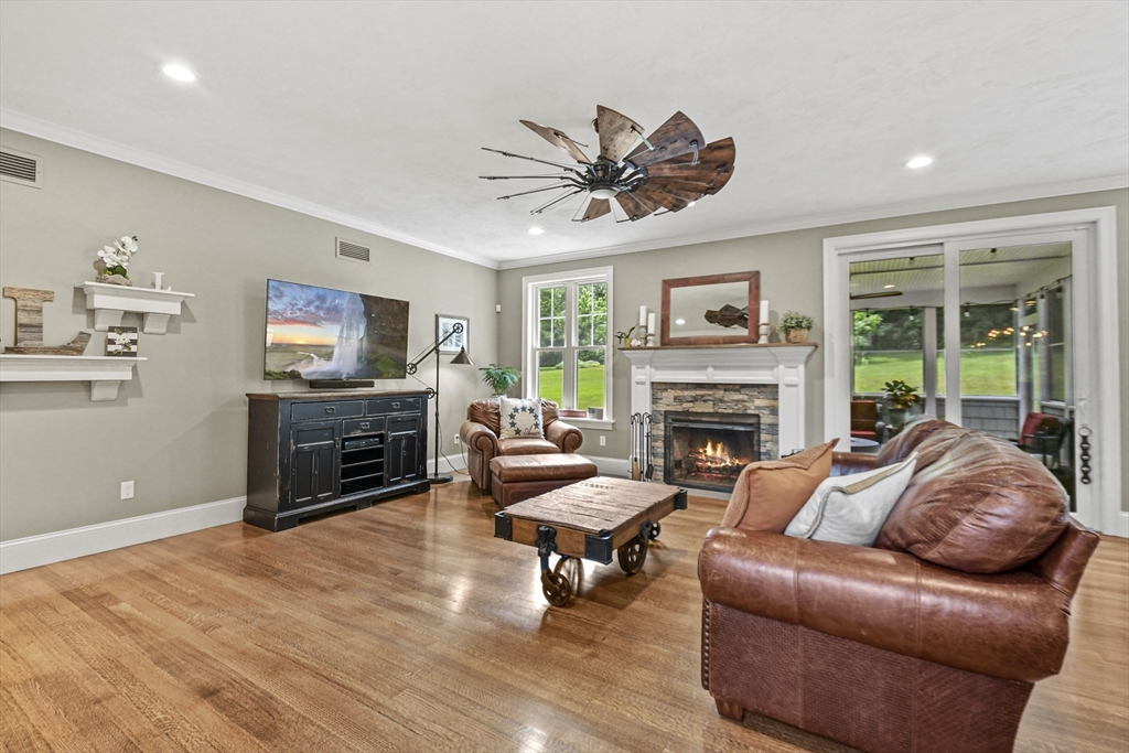 382 West Sutton Road Sutton, MA 01590 - Photo 8 of 42 a living room with furniture a fireplace and a flat screen tv