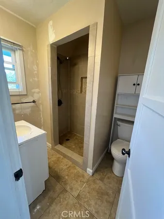 a bathroom with a tub and shower