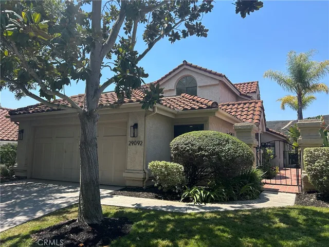 a view of a brick house with a yard
