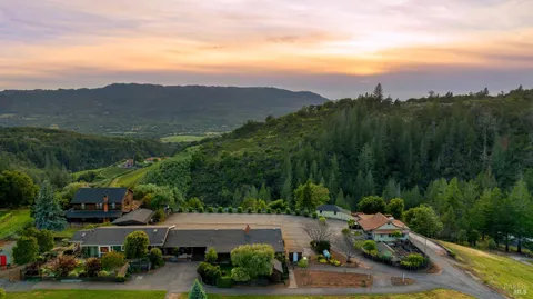 an aerial view of a town with couple of houses