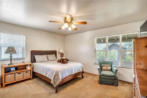 a bedroom with a bed and a couch